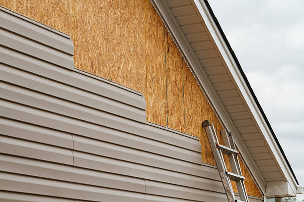 Professional Siding technician working in Groveland, MA